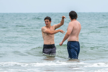 Friends being silly on the beach