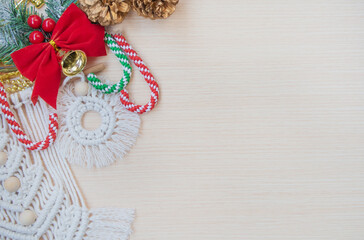 An arrangement of Christmas ornament decorations on wood background with copy space