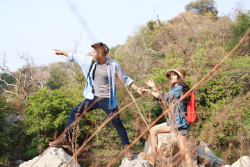 Happy couple going on a hike together in forest