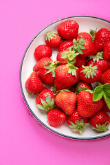 Strawberries on color background.