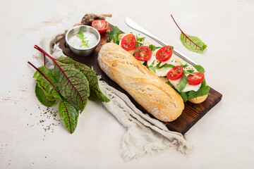 Baguette with tomato and mozzarella.