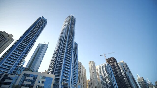 Residential Towers and Skyscrapers in Dubai Marina UAE, Low Angle View From Moving Boat