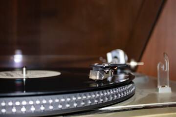 Fototapeta na wymiar Modern vinyl record player with disc on black background, closeup.