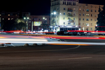 Obraz na płótnie Canvas Night light painting stripes. Road car light streaks. Long exposure photography. Long exposure photo of a street.