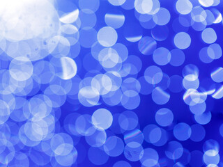 blue white abstract circular background with bokeh defocused blurred lights