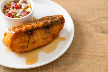 fried snapper fish with fish sauce and spicy salad