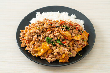 stir-fried minced pork with basil and egg topped on rice