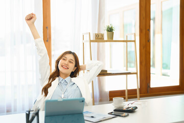Successful business concept, Businesswoman raising arm to stretching after hard working new project
