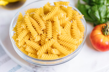 Bolognese pasta in blue plate on bright background. Traditional Italian dish