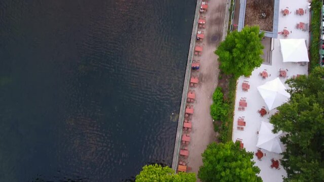 Beer Garden On The Lake, White Umbrellas
Amazing Aerial View Flight Bird's Eye View Drone Footage
Of Lake Schlachtensee Berlin Golden Summer Sunset 2022 4k Cinematic View From Above By Philipp Marnitz