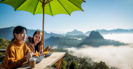 Asian traveller with camera take photo for a fog on a mountain at Japo village