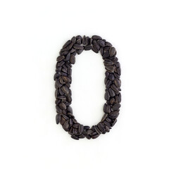 Number 0 made from sunflower seeds. Alphabet made from sunflower seeds. White background