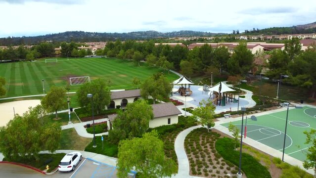 Aerial View, Children's Playground and Sport Fields, Park in Irvine Residential Community, Orange County, California USA, Drone Shot
