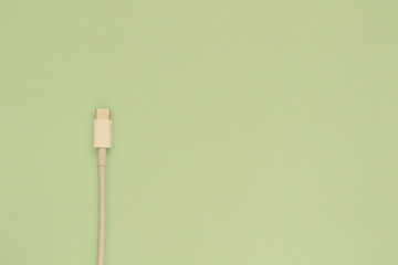 white usb c cable on green background