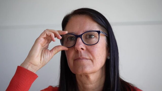 Mature Woman In 50s Trying Her New Eyeglasses. -  Closeup Shot