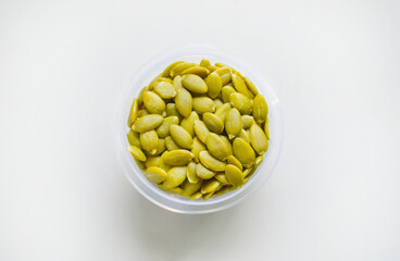 A bowl with the pumpkin seeds with the selective focus. Good for any project. 