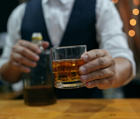 Barman pouring whiskey whiskey glass beautiful night