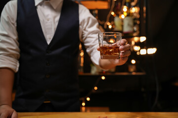 Barman pouring whiskey whiskey glass beautiful night