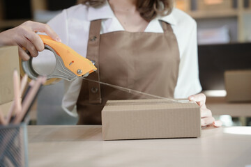 Starting small businesses SME owners asian woman packing box SME business ideas online