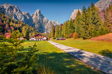 Adorable autumn view of small hottel on Pradidali valley, Province of Trento, Italy, Europe. Gorgeous morning scene of Dolomite Alps. Beauty of countryside concept background. - obrazy, fototapety, plakaty