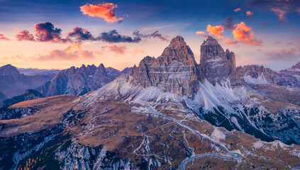 Violet sunrise in Tre Cime Di Lavaredo National Park. Fantastic morning view of Dolomite Alps, Auronzo location, Italy, Europe. Beauty of nature concept background.