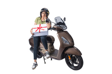 Fototapeta na wymiar Asian woman with a helmet sitting on a scooter and carrying a gift box