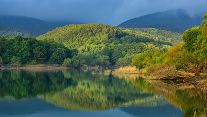 Mountain lake, surrounded by forested slopes