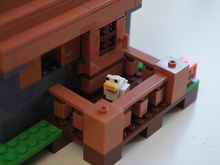 Fototapeta premium Elements and fragments of Lego village world set. Characters of electronic game Minecraft. Children's designer with small details, developing motor skills and imagination.