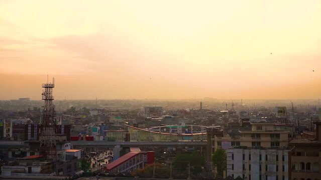 Slow Motion kite flying festival Basant in Pakistan in the evening with city from the top view