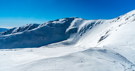 Fototapeta na wymiar Skalka and Ziarska hola hills in winter Low Tatras mountains in Slovakia
