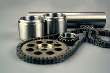 Steel turning and milling parts and gears on a dark background. Metal production