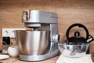 Silver food processor in kitchen interior, kitchen electric mixer on table, Modern kitchen...