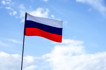 Naklejka premium Flag of Russia on blue sky background. Patriotism, Russia day