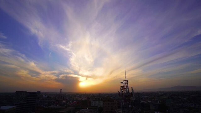 Slow Motion kite flying festival Basant in Pakistan in the evening with city from the top view