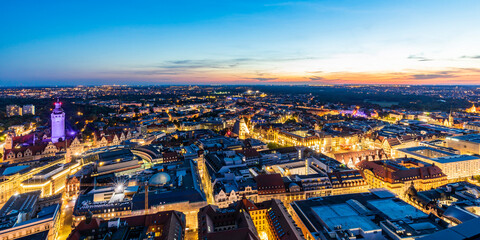 Germany, Saxony, Leipzig, Panoramic view of illuminated city center at dusk