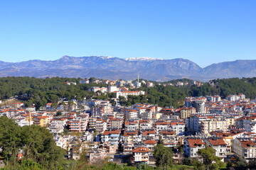 Fototapeta premium Manavgat city aerial panoramic view in Antalya region in Turkey from the Türkbeleni Ormani, turkish flag monument