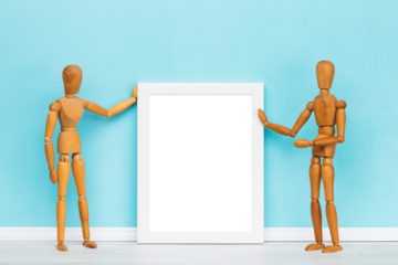 Poster mockup, vertical white transparent picture frame presented by two artist's mannequins in front of turquoise wall