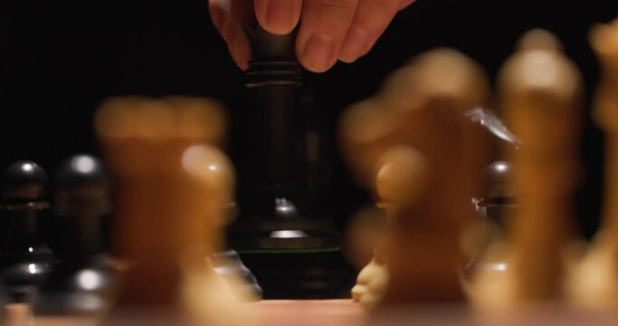 Player moves queen onto chess spot to take white chess piece.