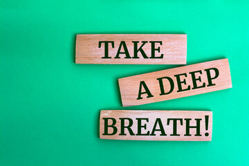 Wooden blocks with words 'Take a deep breath'.
