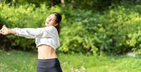 Portrait sport asian beauty body slim woman warming up in sportswear relax and do fitness exercise with stretching workout before fitness training in park.Diet concept.Fitness and healthy