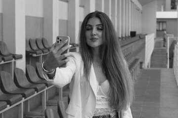 Beautiful woman doing selfie on a smartphone