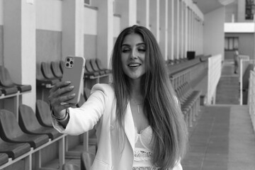 Beautiful woman doing selfie on a smartphone