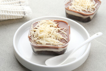 Chocolate dessert box, with cheese topping, creamy and delicious. 
