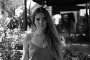 Portrait of beautiful woman at a restaurant in black and white