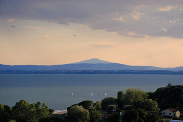 Panoramic view of lake Trasimeno from Passignano at sunset, Italy