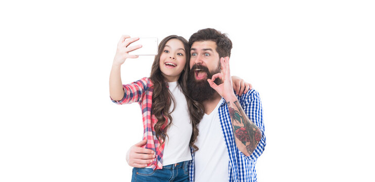 Happy family girl child and bearded man take selfie with mobile camera phone isolated on white, OK