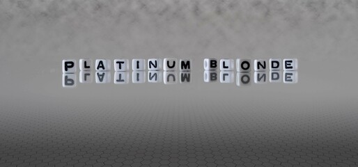 platinum blonde word or concept represented by black and white letter cubes on a grey horizon background stretching to infinity