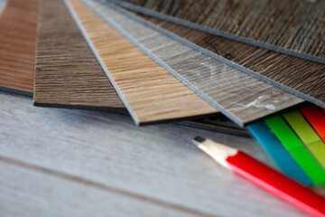 pencils and wooden vinyl floor tile for interior works 