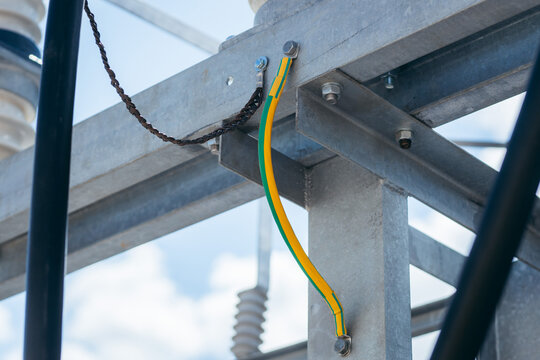 Electrical high voltage ground copper bar at modern power plant. Grounding electric bar on power tower. Cables connected to electrical grounding bar, Ground industry for control system.