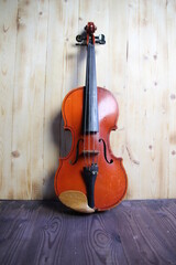 vintage violin on wooden background